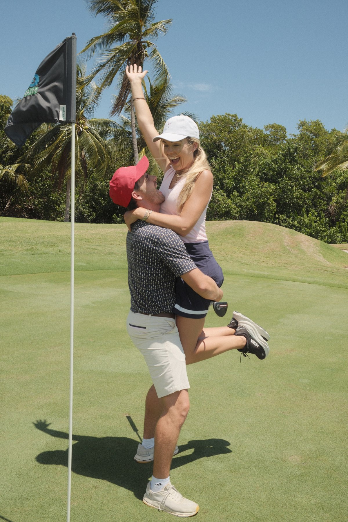 Kendall and Brandon celebrating on the green